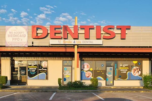 Exterior of Aspen Dental clinic with branded signage showing standardized national dental network presence